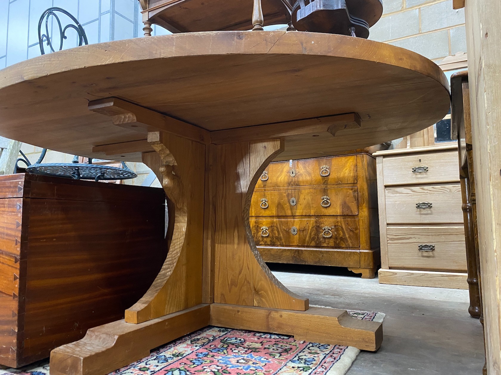 A 'Woodpecker Man' adzed oak dining table, with oval top and chip carved underframe, 170cm x 146cm